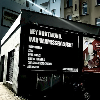 Plakat: Hey Dortmund, wie vermissen euch!